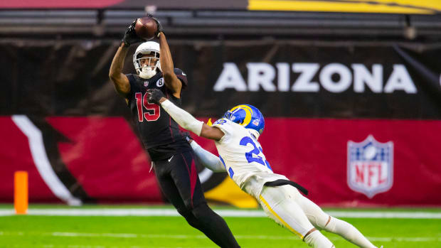 Dec 6, 2020; Glendale, Arizona, USA; Arizona Cardinals wide receiver KeeSean Johnson (19) makes a catch against Los Angeles Rams cornerback Troy Hill (22) in the second half at State Farm Stadium. Mandatory Credit: Mark J. Rebilas-USA TODAY Sports  